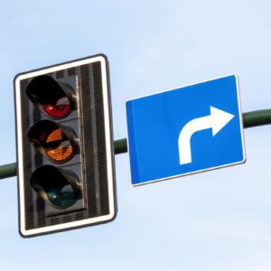 Traffic signal with blue right arrow sign