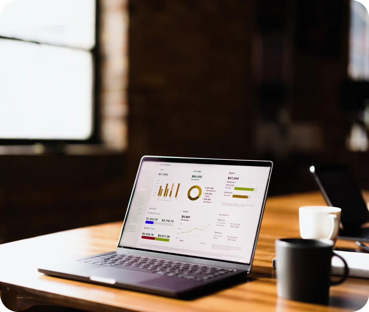 Open laptop showing financial data analysis