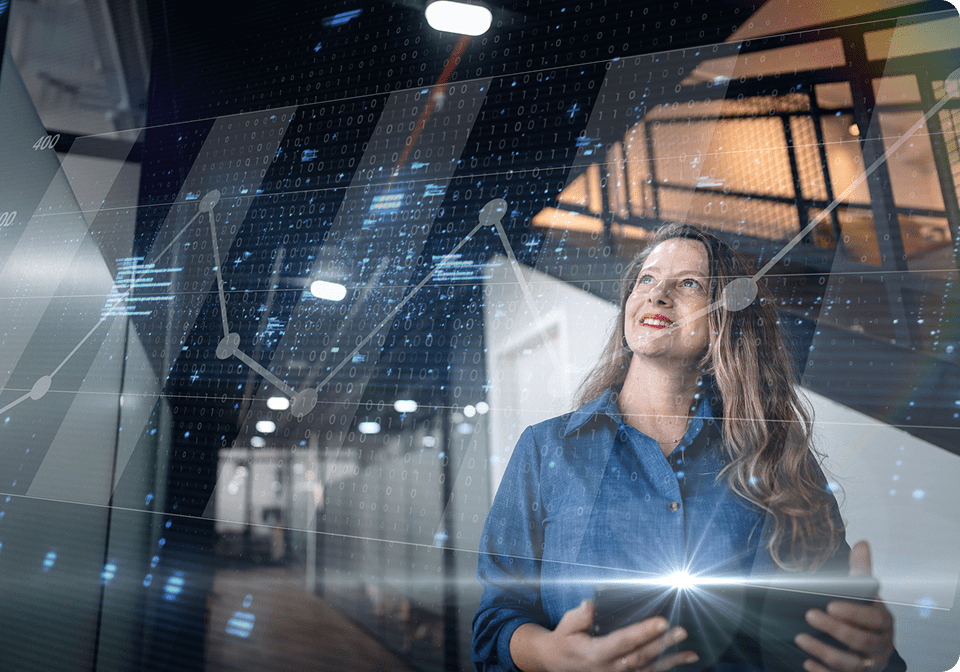 Businesswoman analyzing data trends on holographic display.