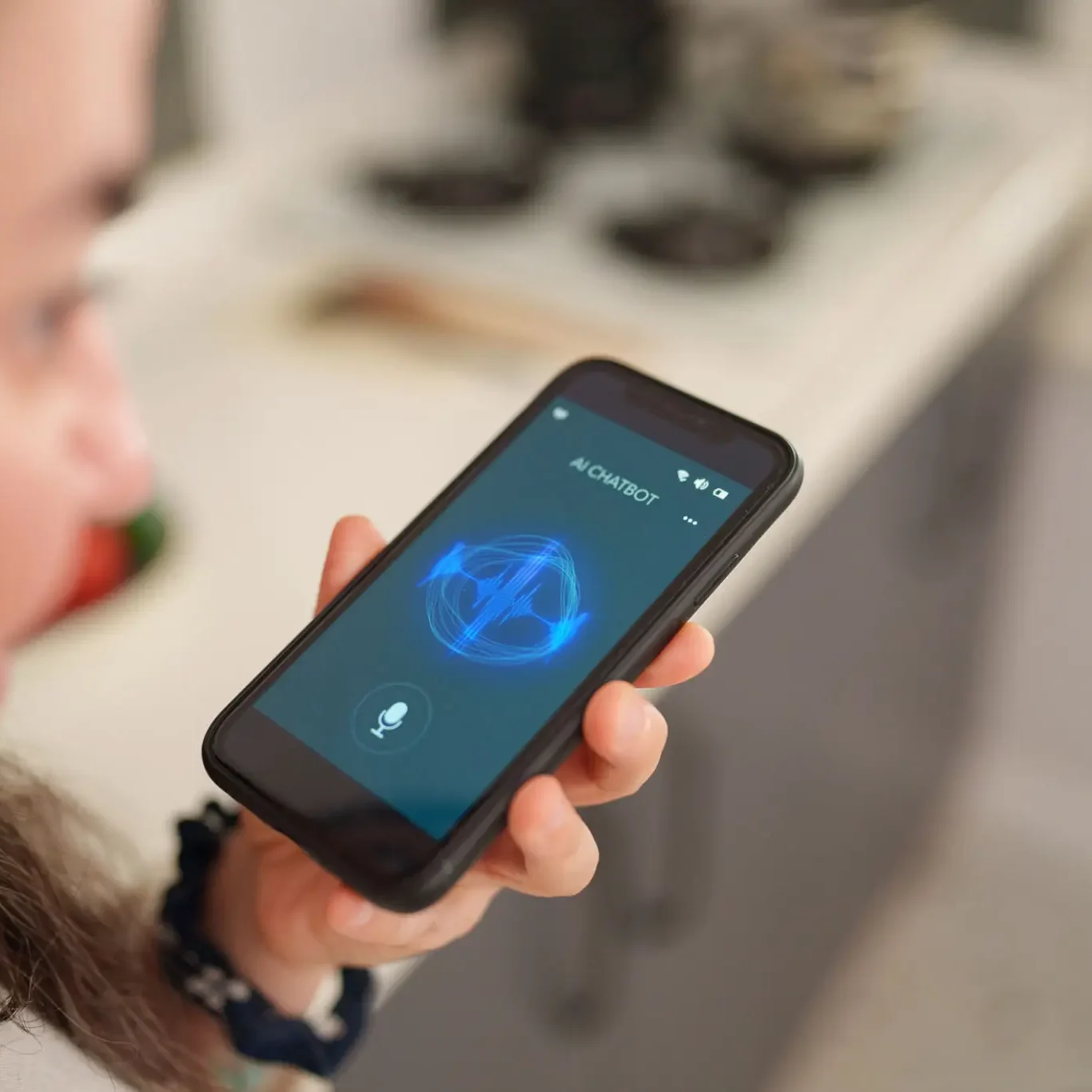 Person holding smartphone with voice assistant